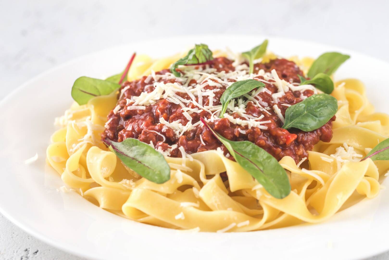 Portion of tagliatelle with bolognese sauce
